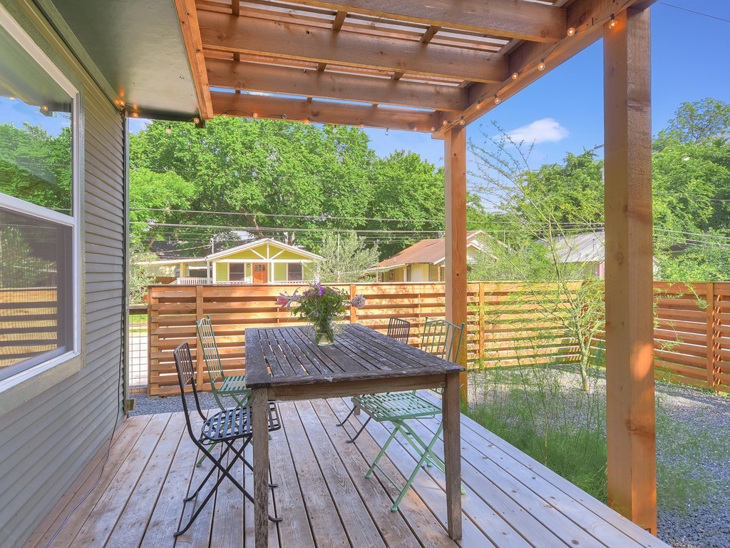 1313 Garden Street Austin, TX 78702 - Photo 20 of 23 a view of a balcony with floor to ceiling windows with wooden floor