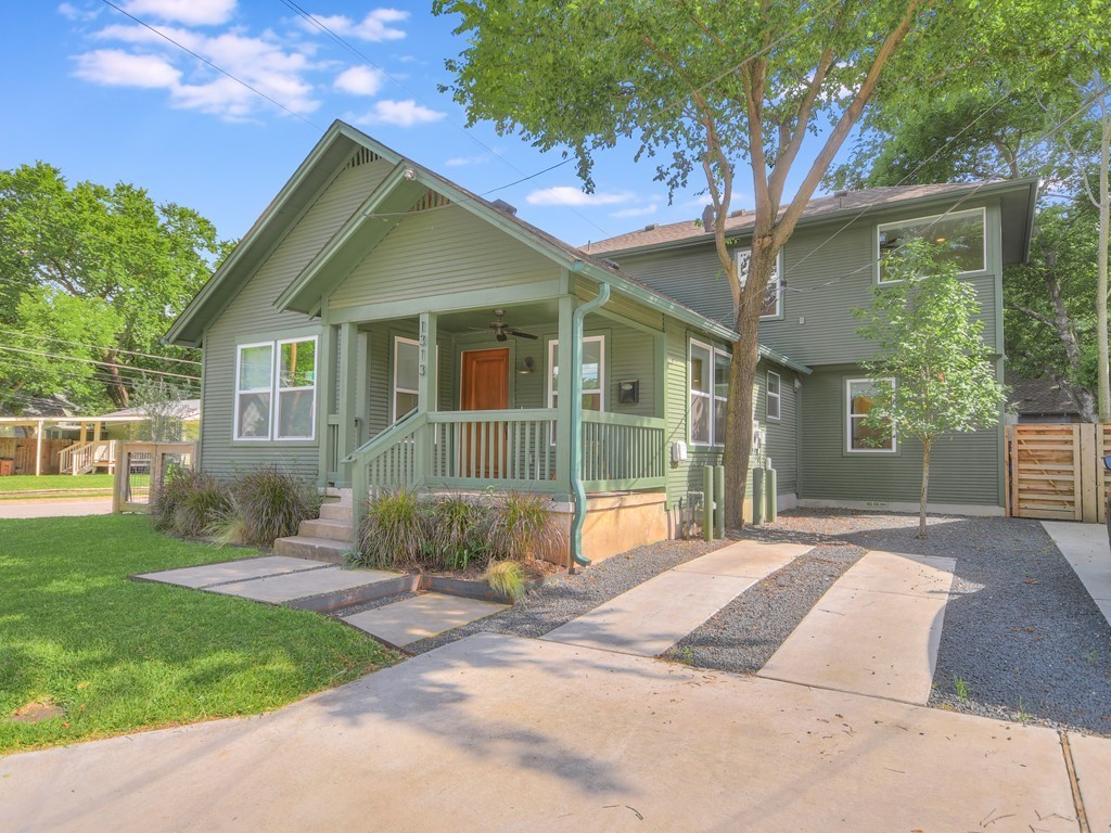 1313 Garden Street Austin, TX 78702 - Photo 2 of 23 a front view of a house with garden