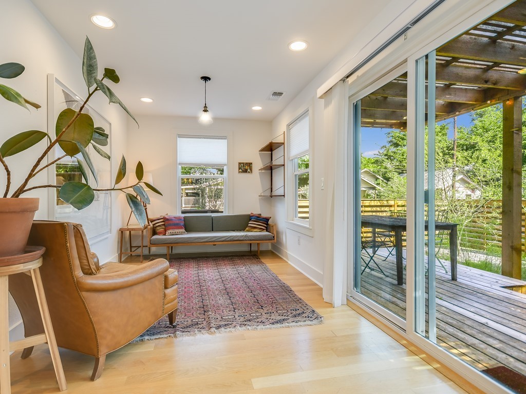 1313 Garden Street Austin, TX 78702 - Photo 6 of 23 a living room with furniture and a large window