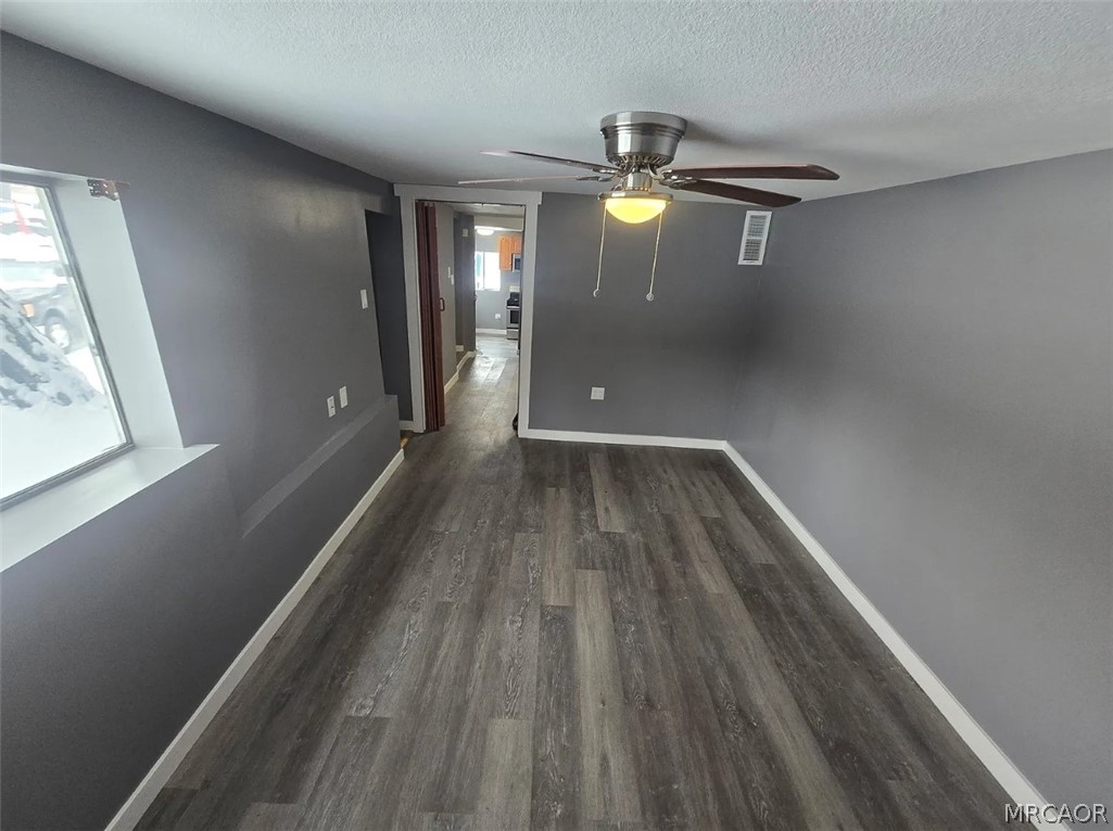 32928 Rim Of The World Highway Running Springs, CA 92382 - Photo 5 of 7 a view of empty room with wooden floor