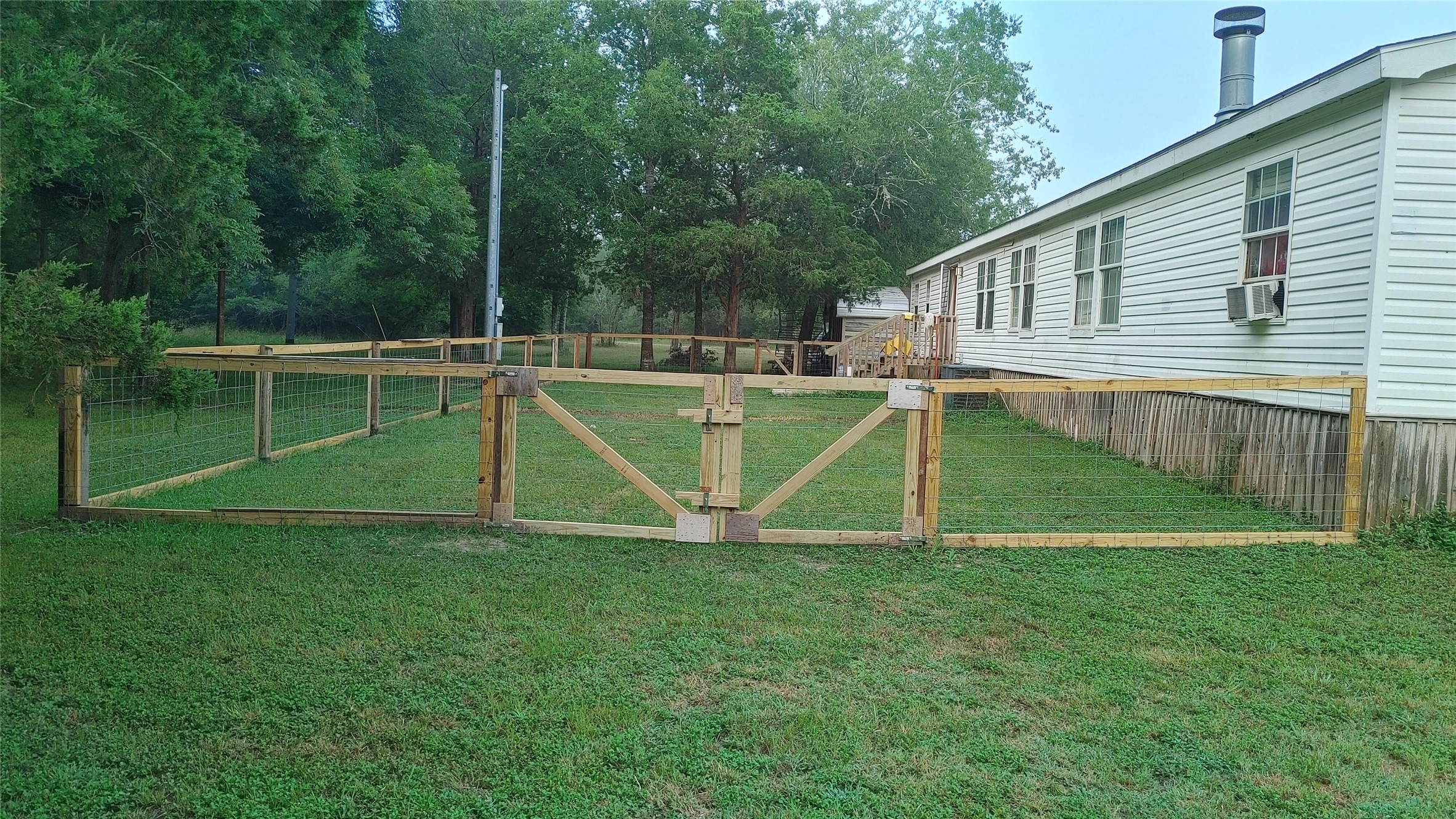 270 Country Way Road Smithville, TX 78957 - Photo 2 of 24 a view of a house with a backyard