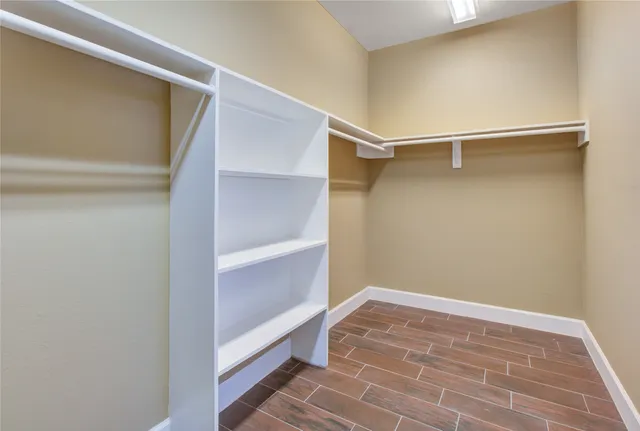 a view of an empty walk in closet