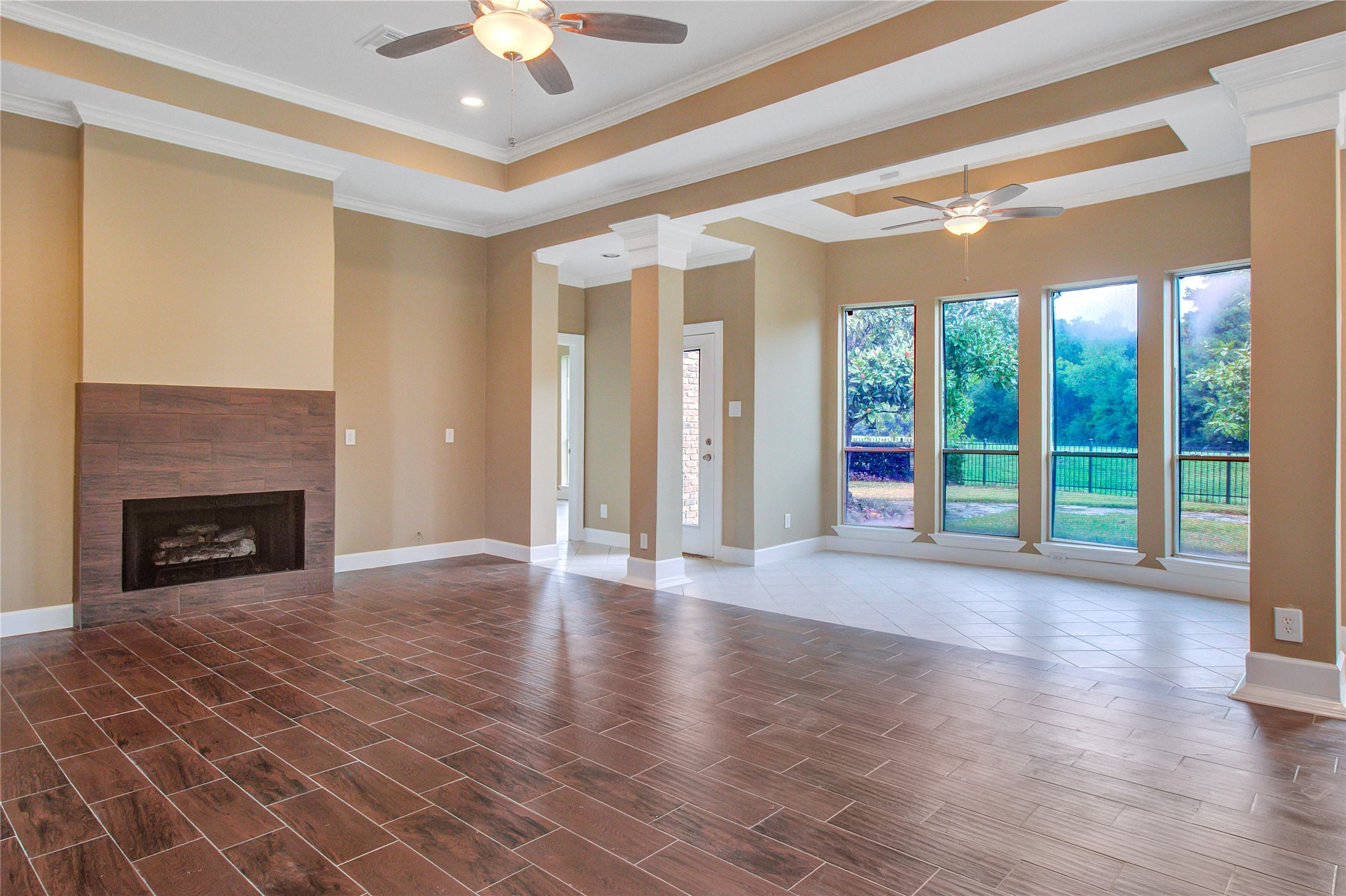 6214 Agassi Ace Court Spring, TX 77379 - Photo 12 of 18 a view of an empty room with a fireplace and a window