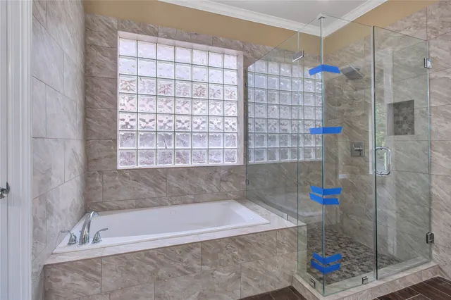 a bath tub sitting next to a shower