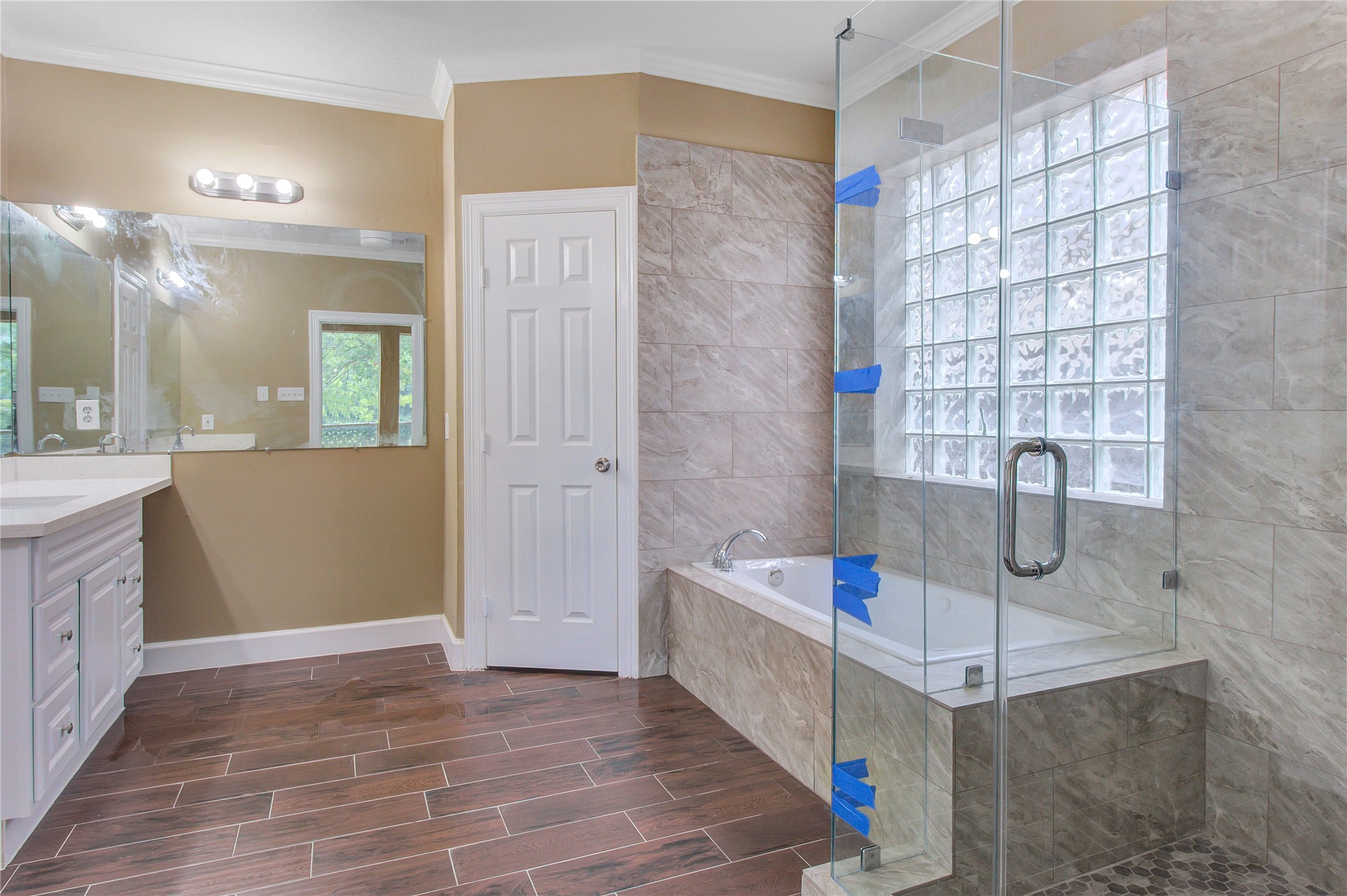 6214 Agassi Ace Court Spring, TX 77379 - Photo 17 of 18 a bathroom with a tub shower sink and mirror