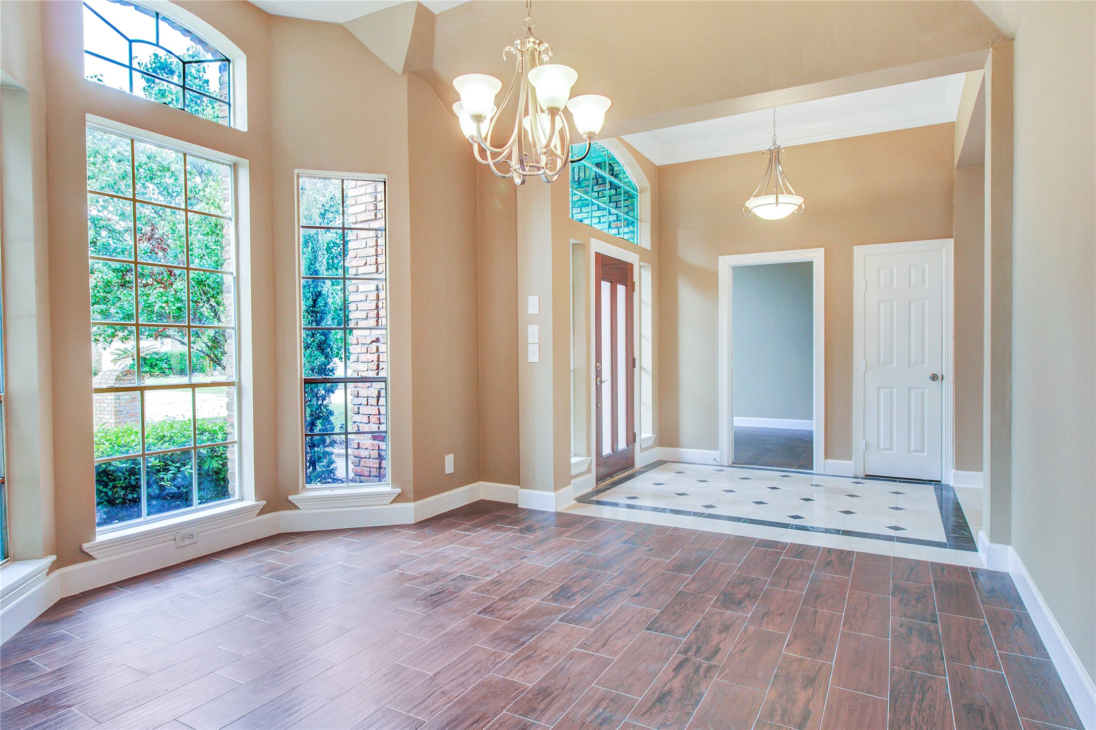 6214 Agassi Ace Court Spring, TX 77379 - Photo 5 of 18 a view of an empty room with wooden floor and a window