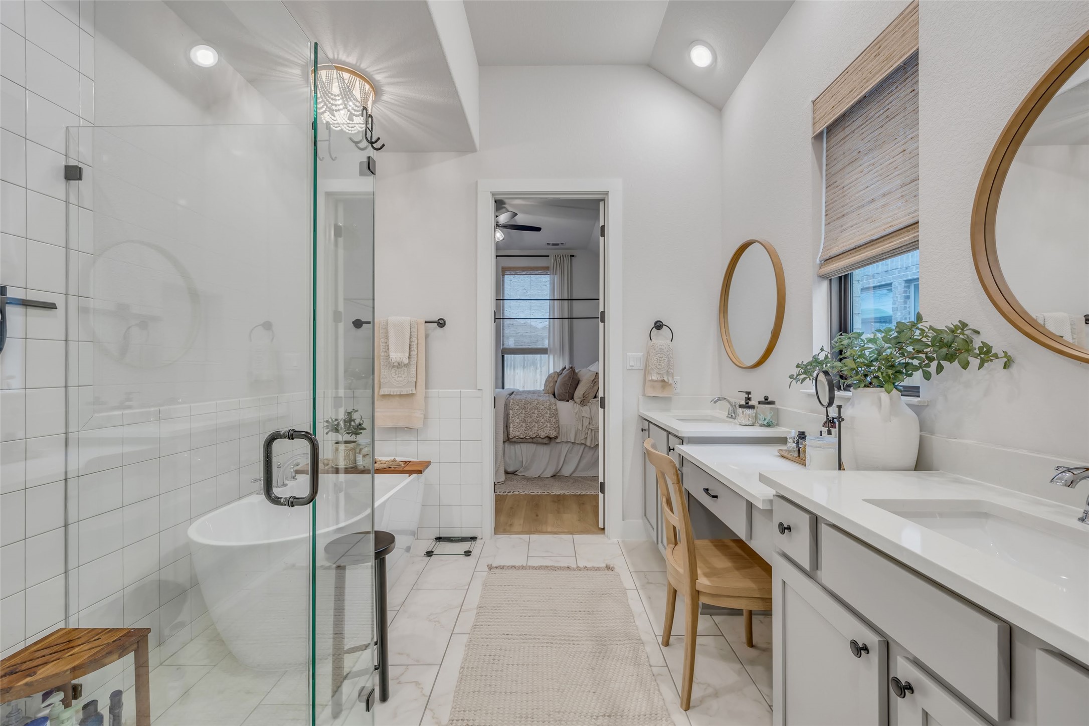 1901 Sir Nathaniel Lane Leander, TX 78641 - Photo 23 of 40 Full bath with ensuite bath, tile walls, a stall shower, two vanities, and a freestanding bath