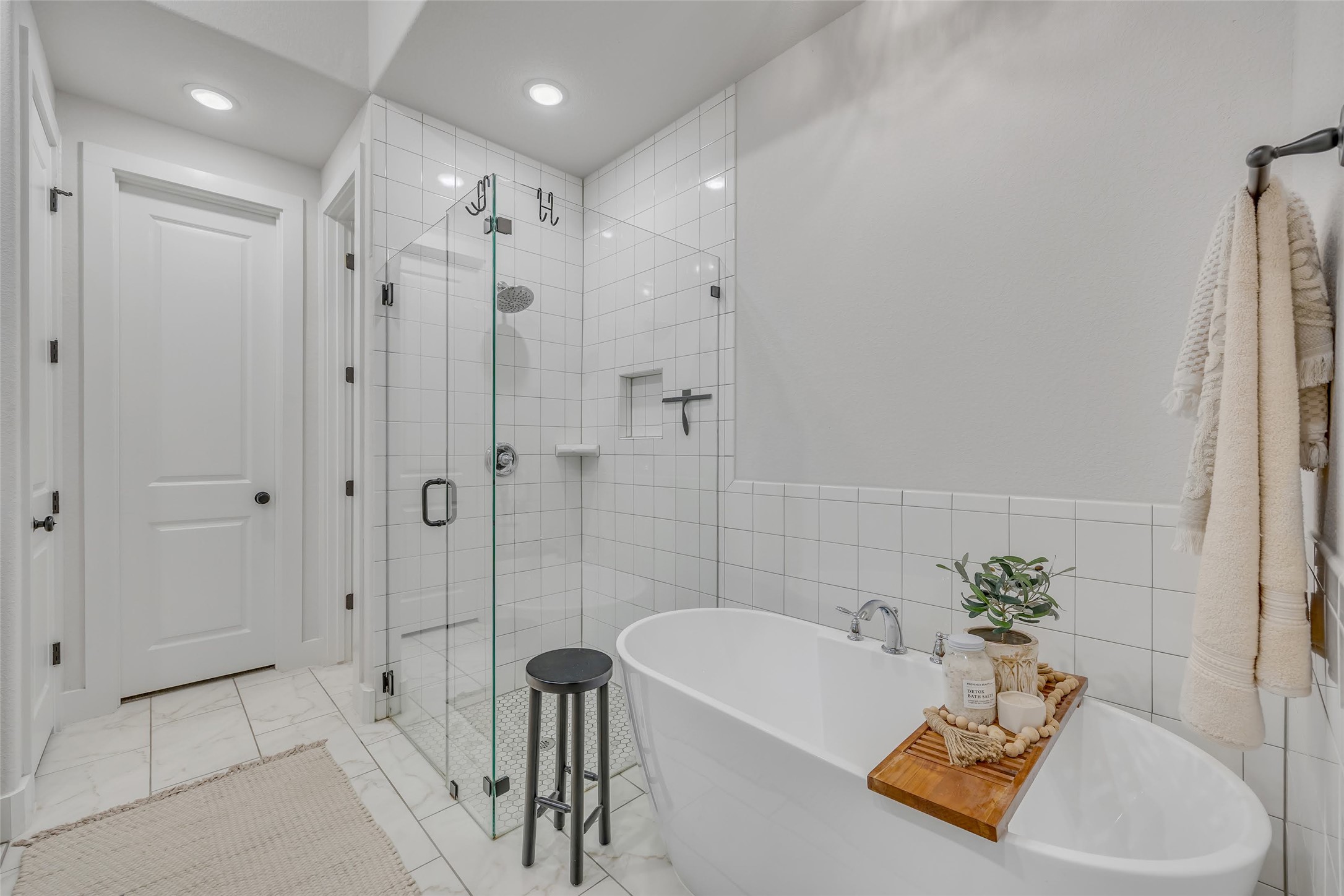 1901 Sir Nathaniel Lane Leander, TX 78641 - Photo 24 of 40 Bathroom with a freestanding bath, a stall shower, tile walls, and recessed lighting
