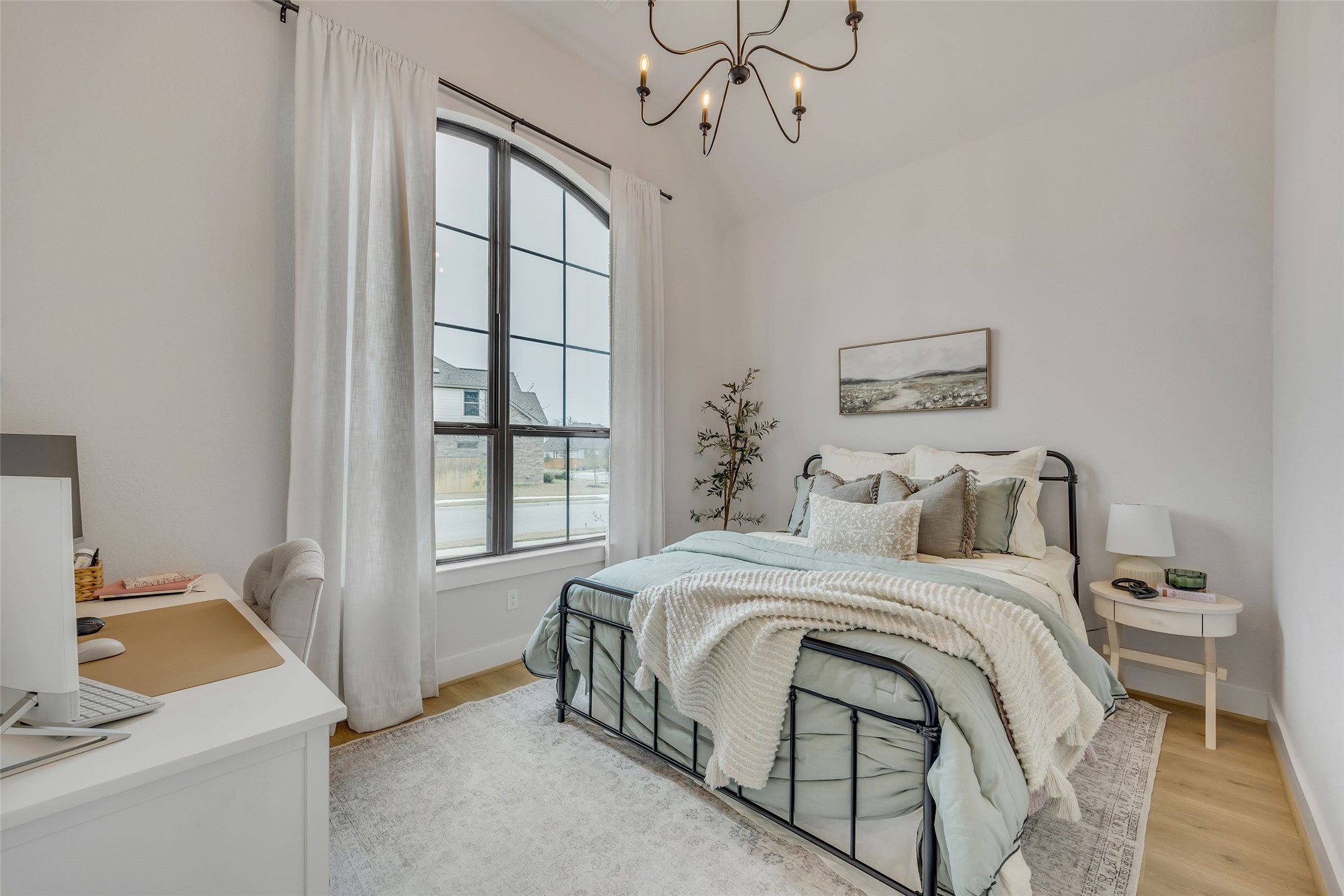 1901 Sir Nathaniel Lane Leander, TX 78641 - Photo 33 of 40 Bedroom featuring light wood-style floors, an office area, and hanging lights