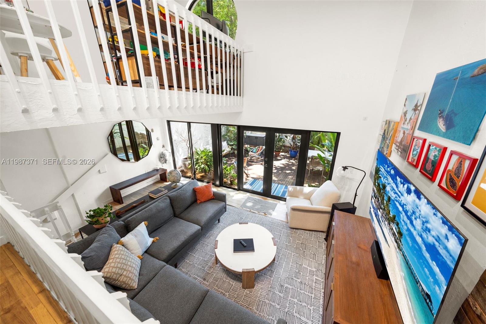 3237 Mary Street, Unit 6 Miami, FL 33133 - Photo 14 of 54 a living room with furniture and a rug