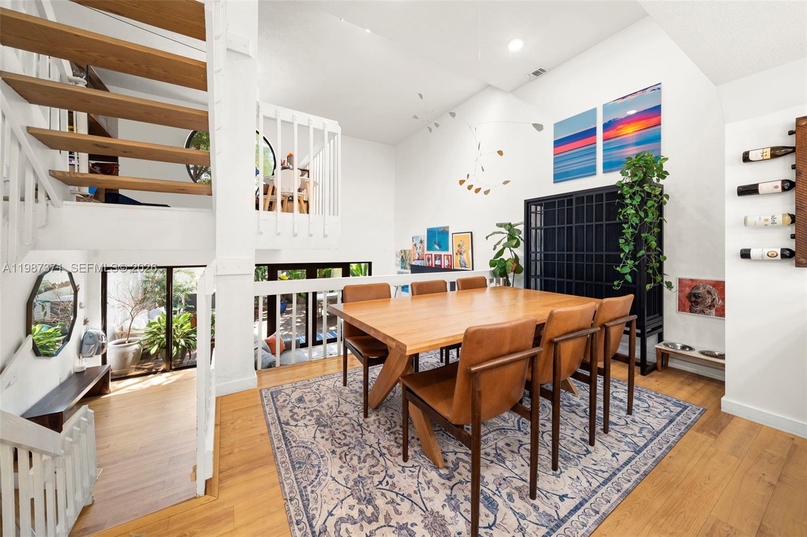 3237 Mary Street, Unit 6 Miami, FL 33133 - Photo 15 of 54 a outdoor dining space with furniture and wooden floor