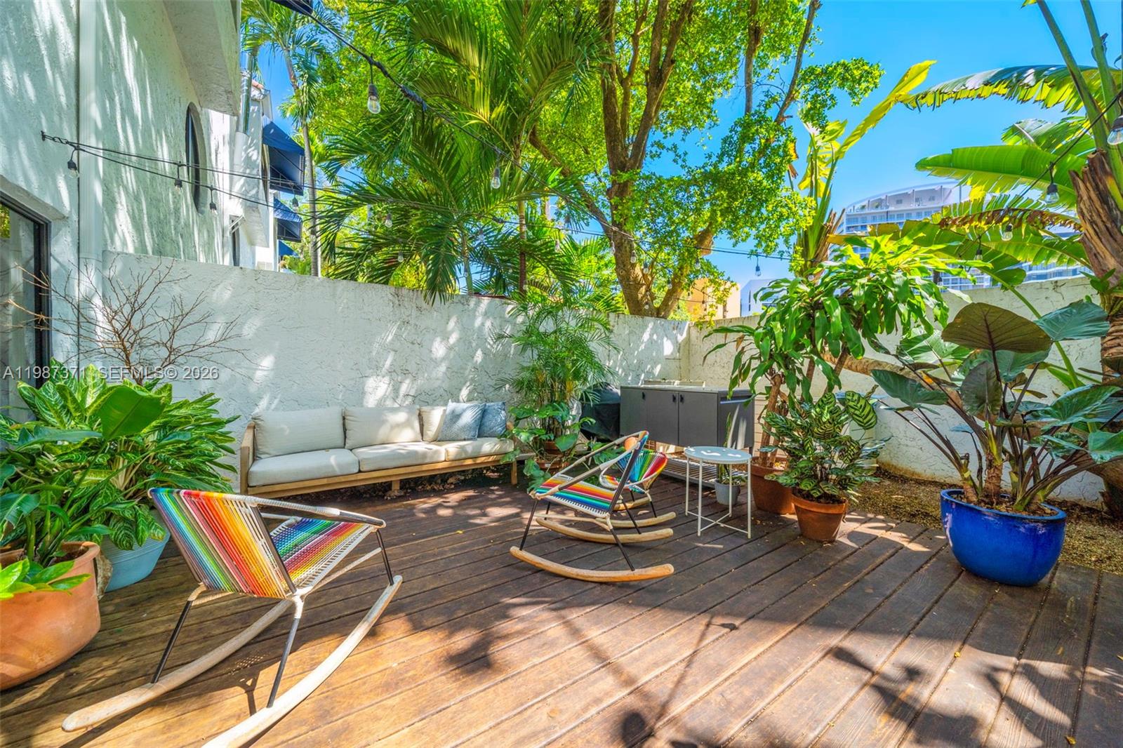 3237 Mary Street, Unit 6 Miami, FL 33133 - Photo 21 of 54 a view of a backyard with sitting area