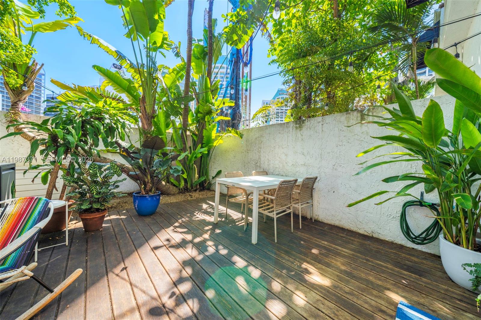 3237 Mary Street, Unit 6 Miami, FL 33133 - Photo 22 of 54 a view of a backyard with sitting area