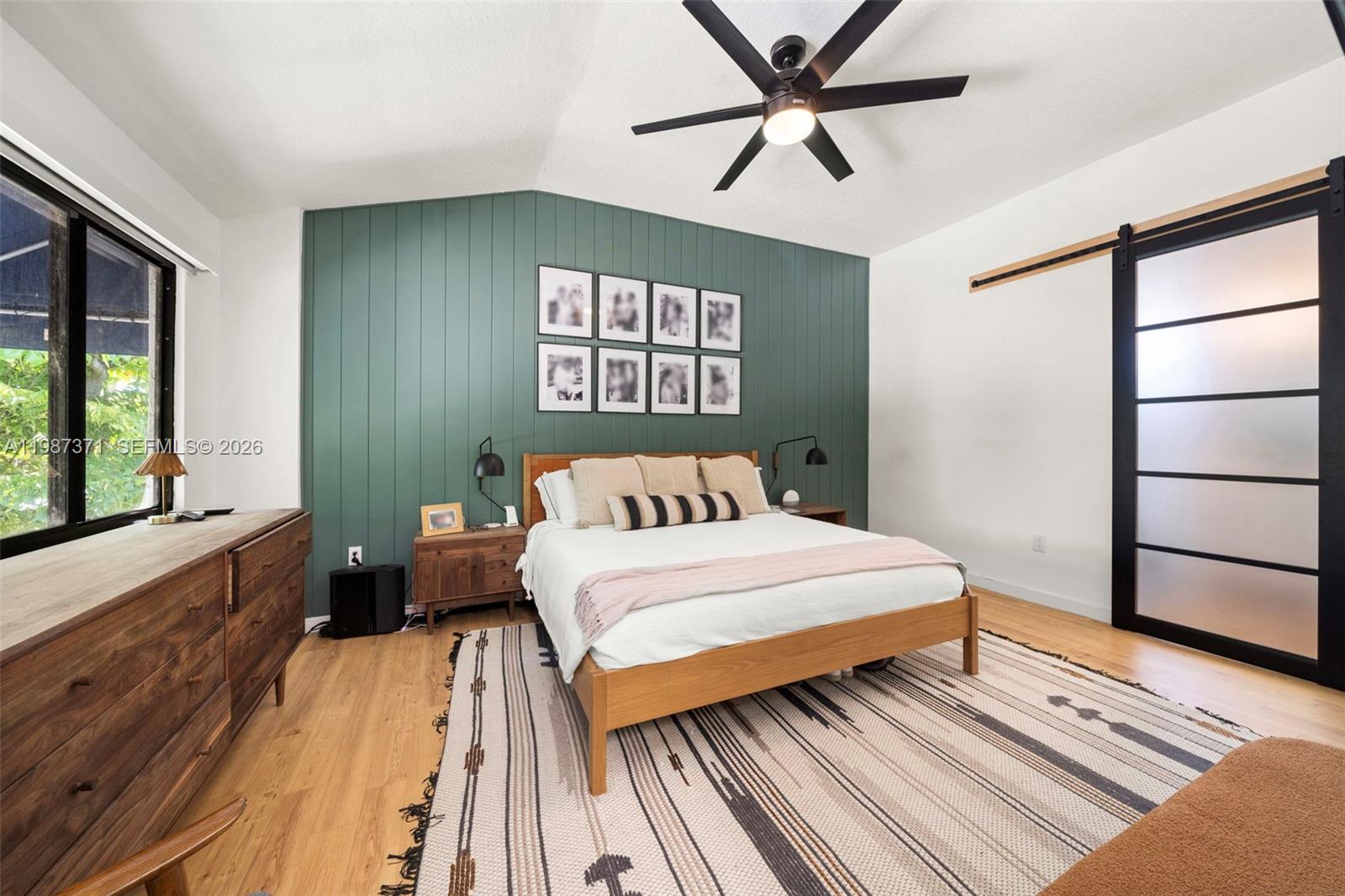 3237 Mary Street, Unit 6 Miami, FL 33133 - Photo 33 of 54 a bedroom with a bed and a large window