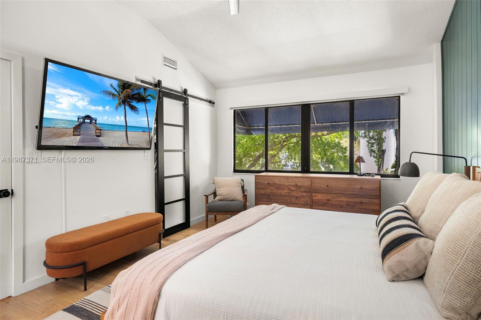 3237 Mary Street, Unit 6 Miami, FL 33133 - Photo 34 of 54 a bedroom with a large bed and a couch