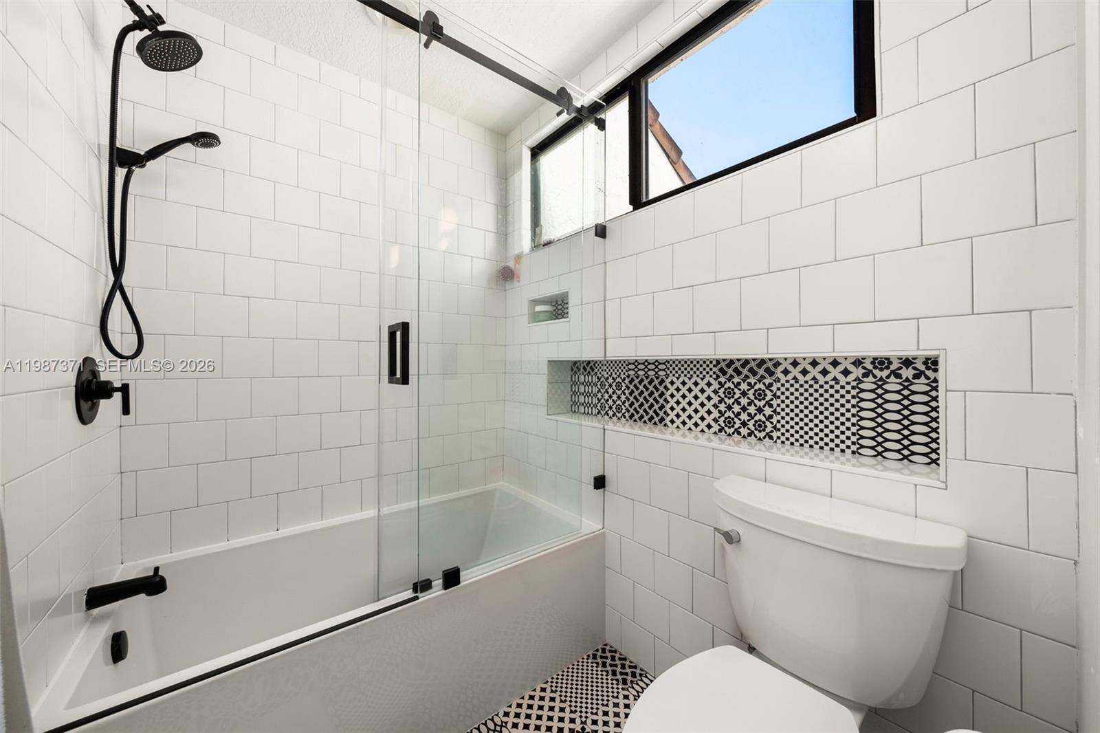 3237 Mary Street, Unit 6 Miami, FL 33133 - Photo 36 of 54 a bathroom with a shower a toilet and a shower