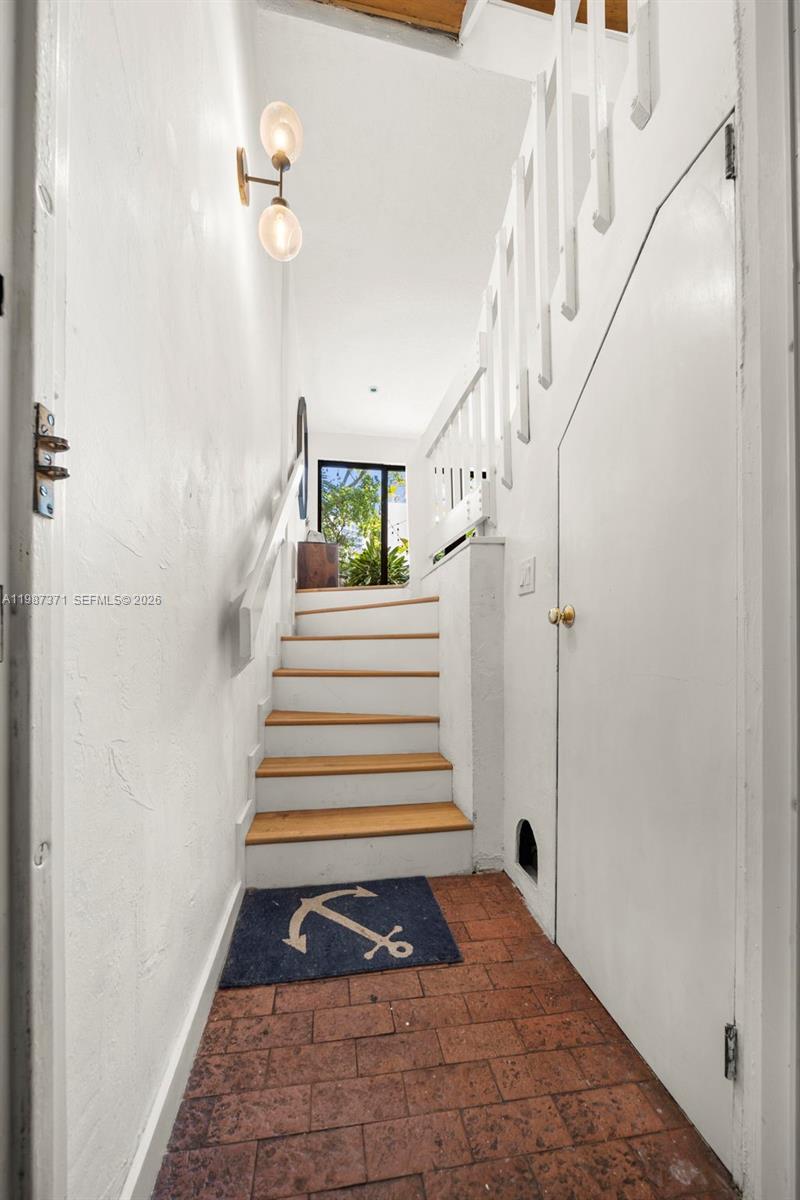 3237 Mary Street, Unit 6 Miami, FL 33133 - Photo 41 of 54 a view of entryway and hall with wooden floor