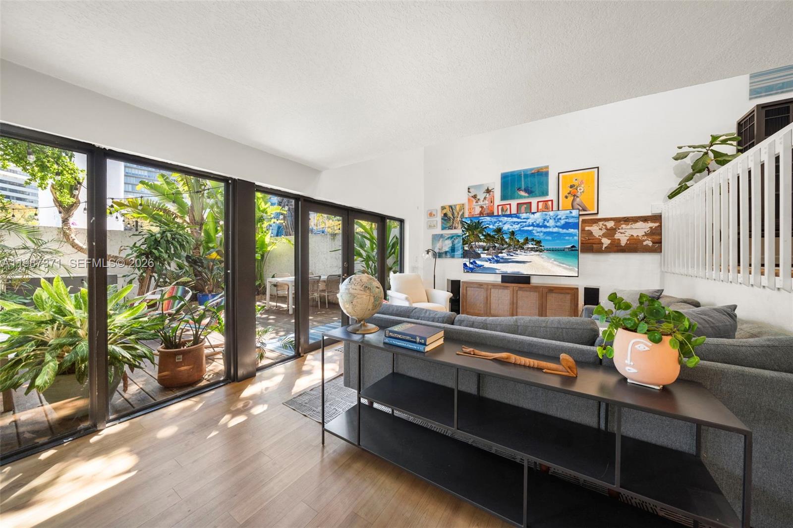 3237 Mary Street, Unit 6 Miami, FL 33133 - Photo 5 of 54 a living room with furniture and a potted plant