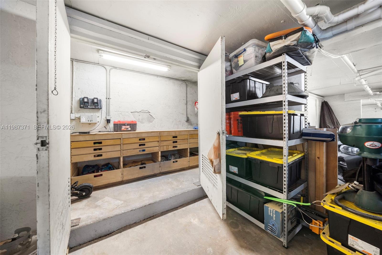 3237 Mary Street, Unit 6 Miami, FL 33133 - Photo 53 of 54 a view of walk in closet with clothes and shoes