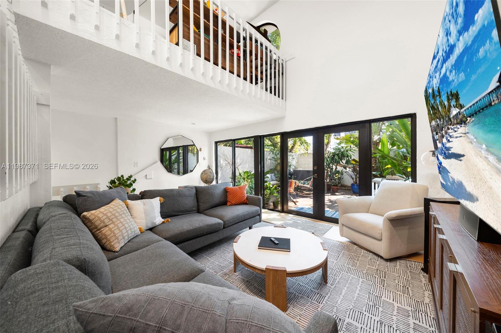 3237 Mary Street, Unit 6 Miami, FL 33133 - Photo 7 of 54 a living room with furniture and a large window
