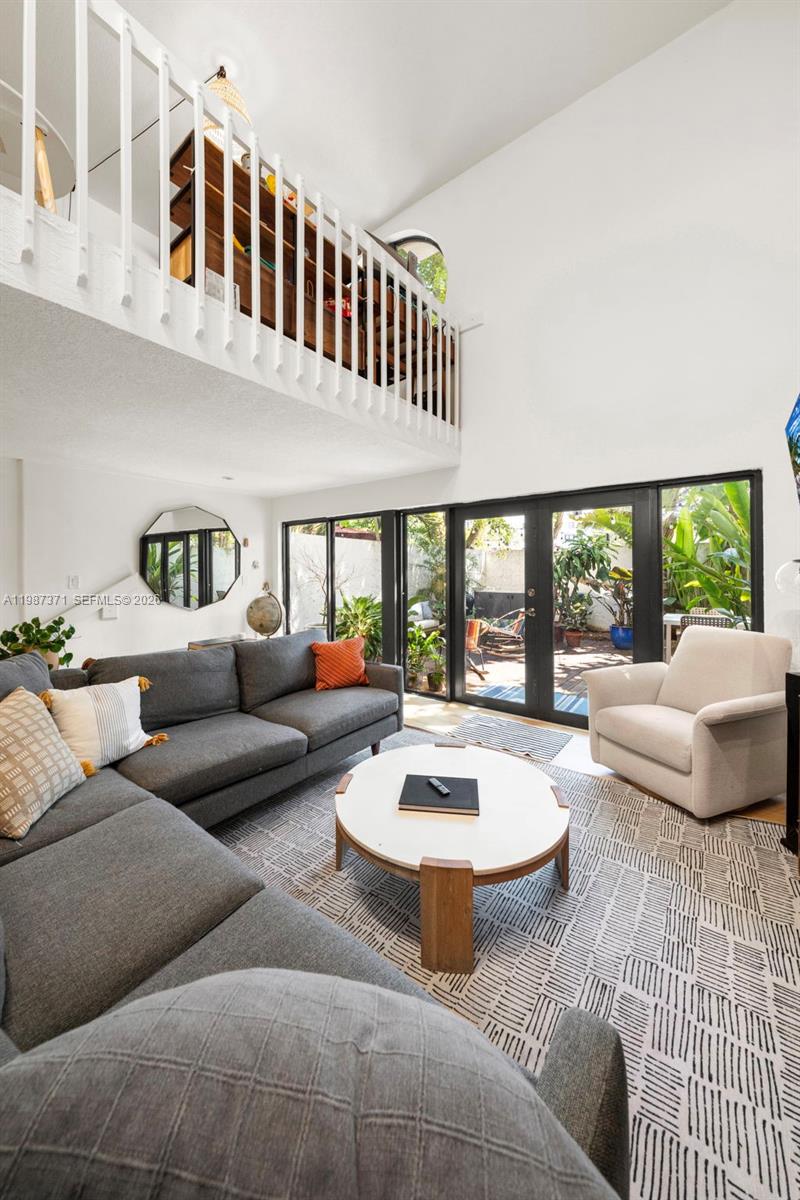 3237 Mary Street, Unit 6 Miami, FL 33133 - Photo 8 of 54 a living room with furniture and a large window