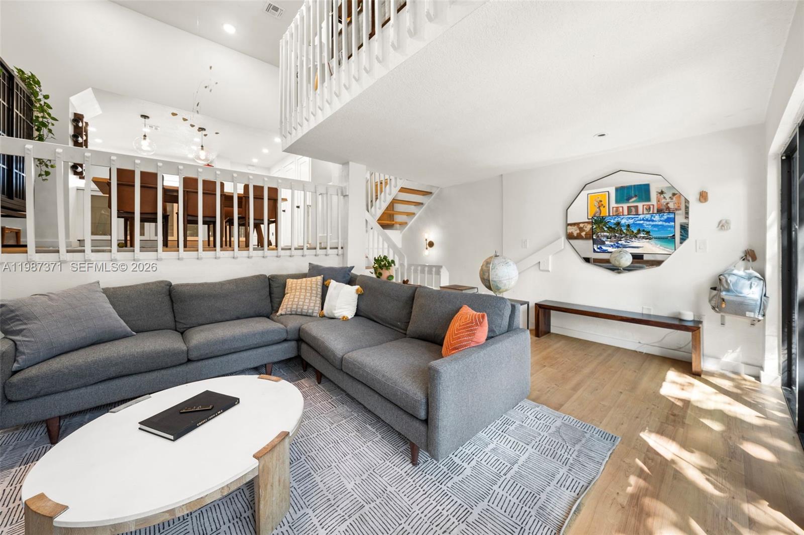 3237 Mary Street, Unit 6 Miami, FL 33133 - Photo 9 of 54 a living room with furniture a rug and white walls