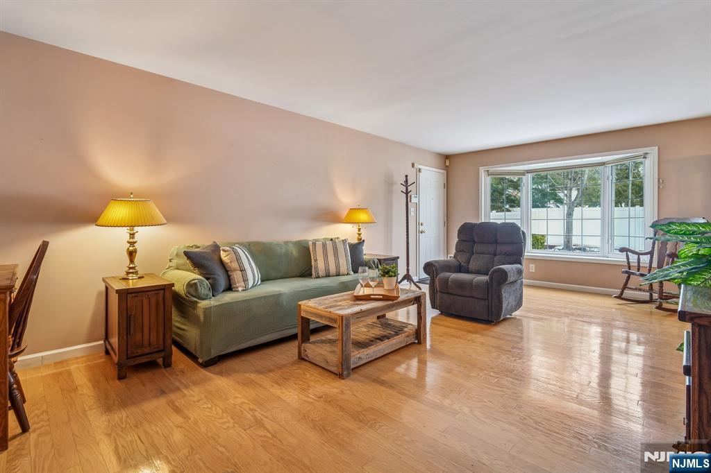 17 Chanda Court, Unit B017 Clifton, NJ 07012 - Photo 5 of 23 a living room with furniture and a large window