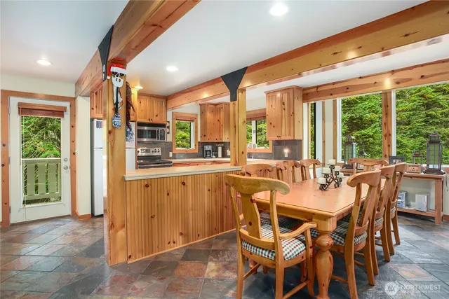 a view of a dining room with furniture window and outside view