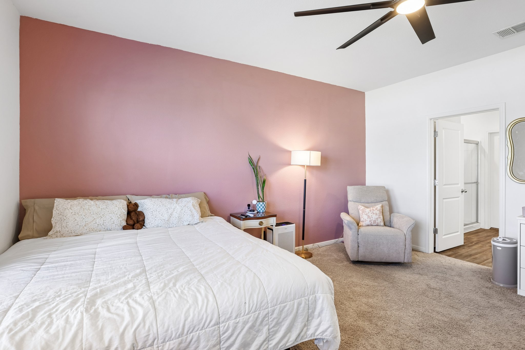 19105 Mike Mansfield Road Manor, TX 78653 - Photo 14 of 28 a bedroom with a bed and with chair