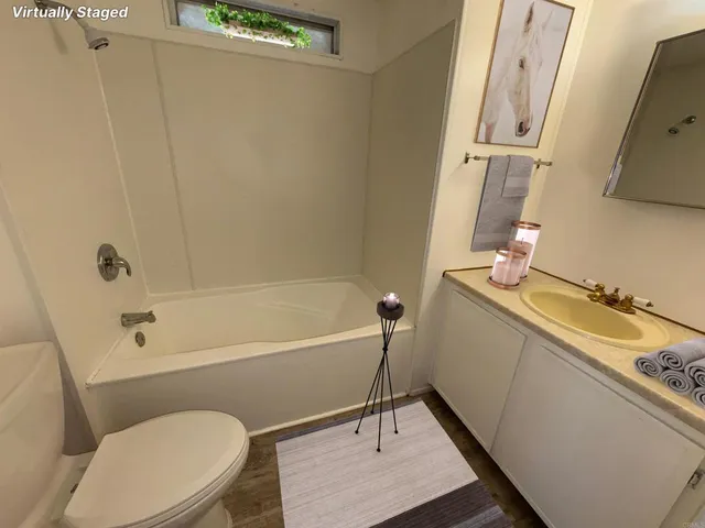 a bathroom with a sink a toilet and a bathtub