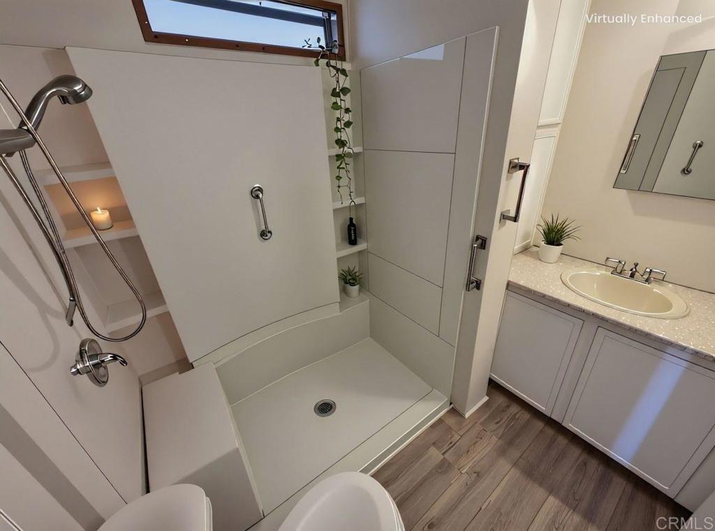 41 Hummingbird Lane Oceanside, CA 92057 - Photo 6 of 13 a bathroom with a granite countertop sink mirror vanity and toilet