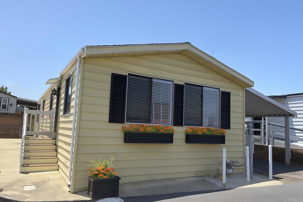 41 Hummingbird Lane Oceanside, CA 92057 - Photo 10 of 13 a view of house with outdoor space