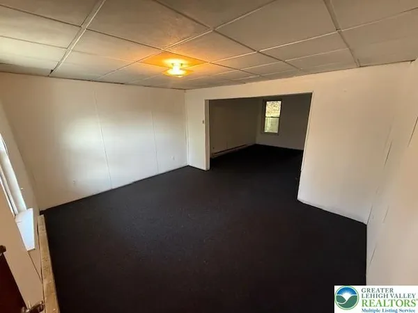 a view of an empty room with windows