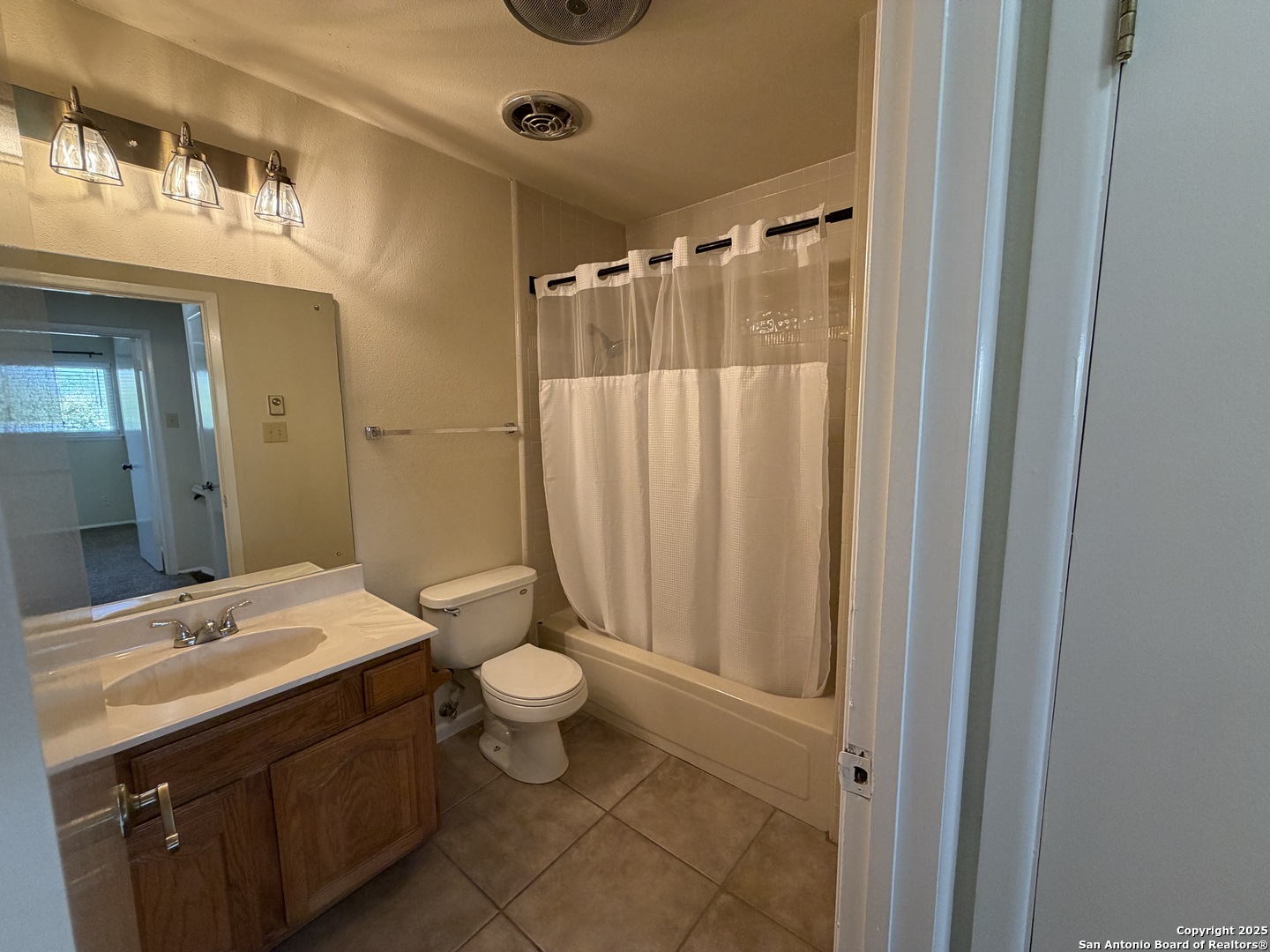 1236 East Live Oak Road Schertz, TX 78154 - Photo 13 of 20 a bathroom with a sink a toilet and shower