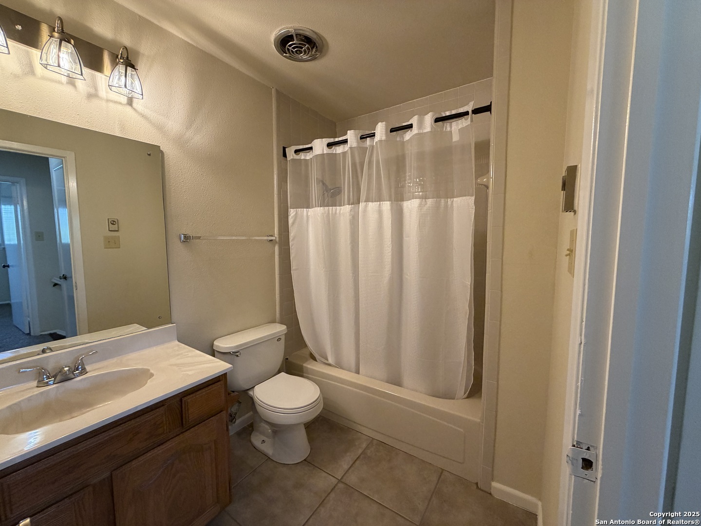 1236 East Live Oak Road Schertz, TX 78154 - Photo 14 of 20 a bathroom with a sink a toilet and shower