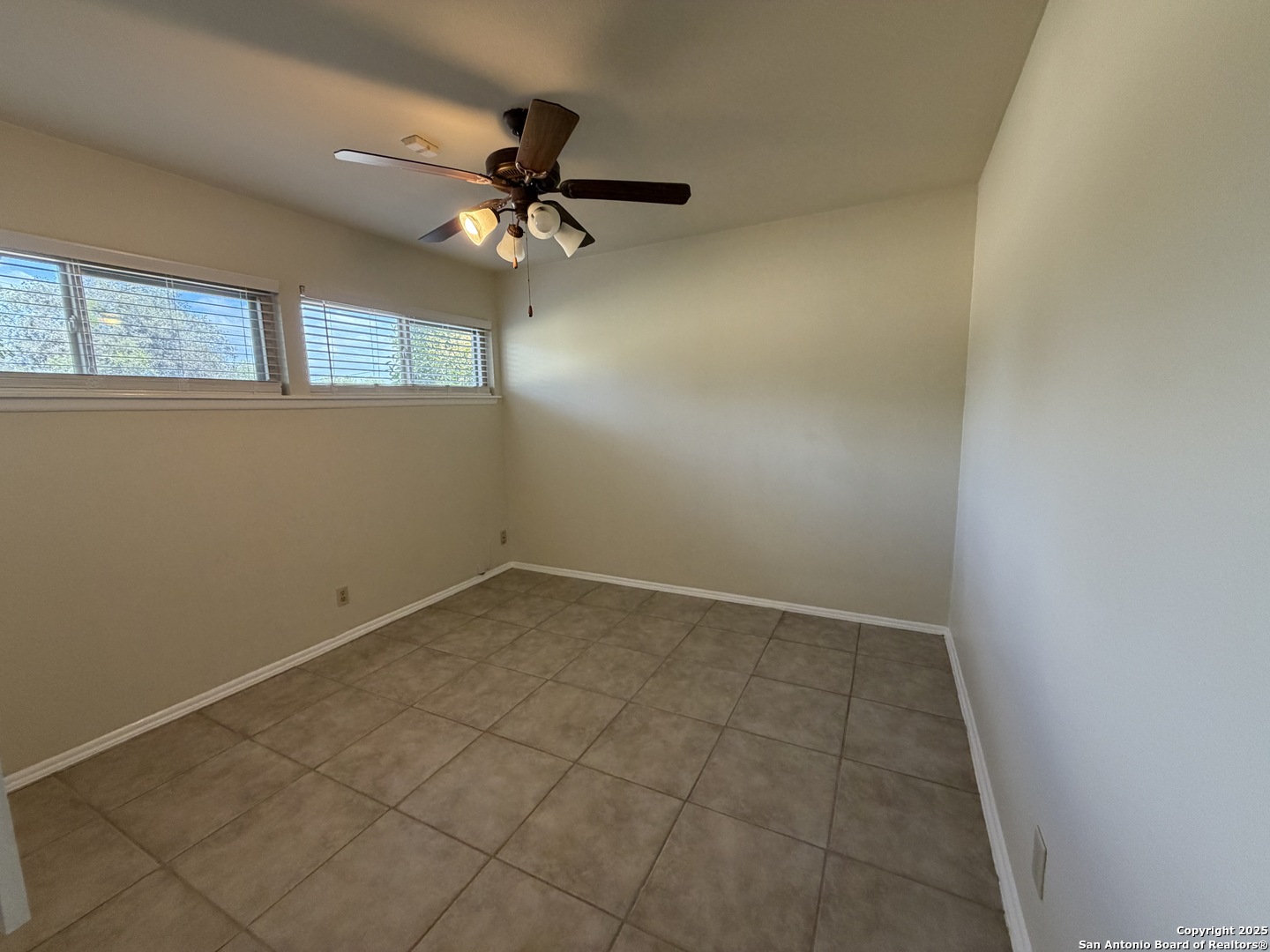 1236 East Live Oak Road Schertz, TX 78154 - Photo 18 of 20 an empty room with a window and a fan