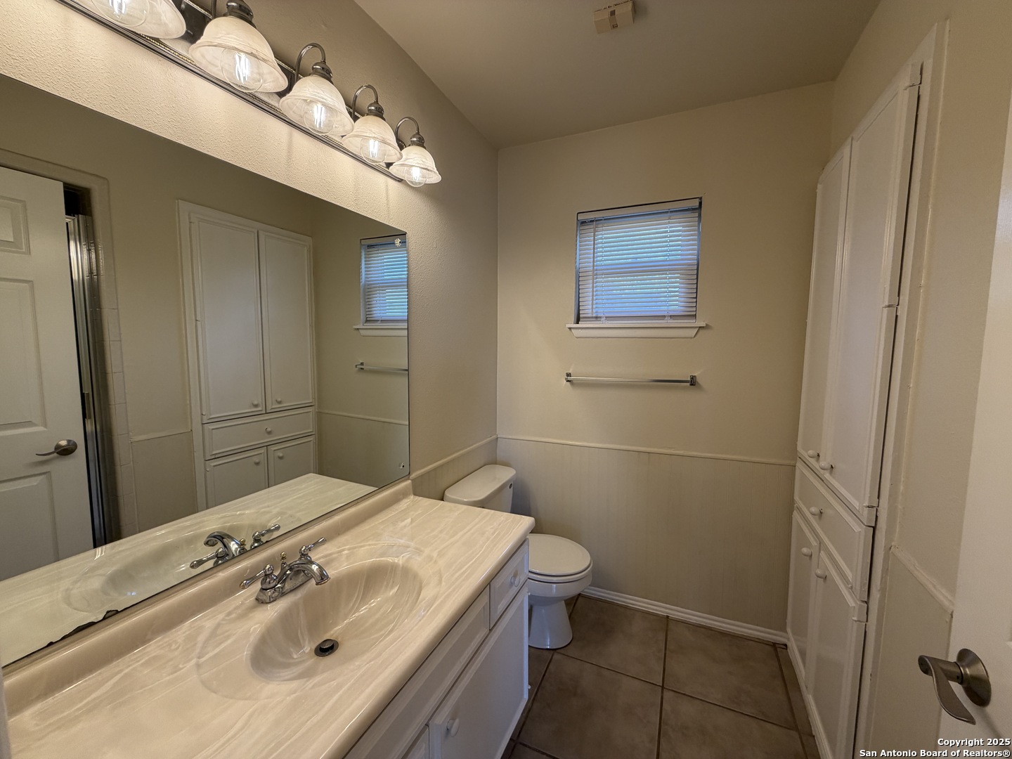1236 East Live Oak Road Schertz, TX 78154 - Photo 19 of 20 a bathroom with a sink a toilet and shower