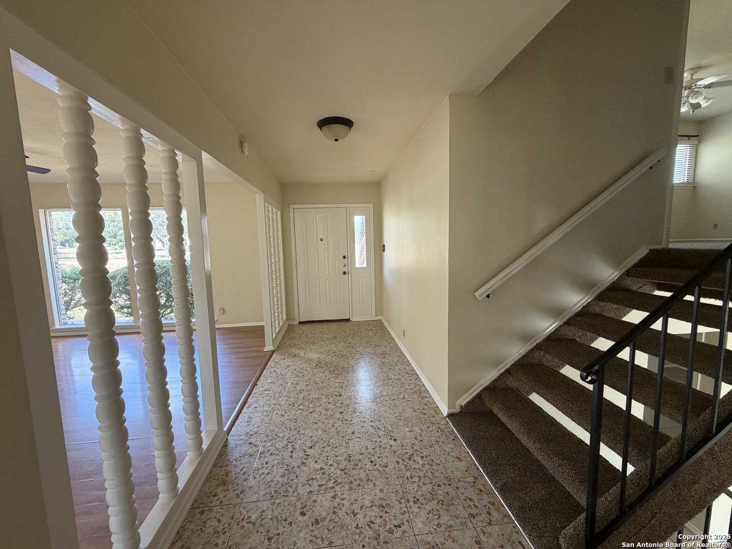 1236 East Live Oak Road Schertz, TX 78154 - Photo 6 of 20 a view of a hallway with wooden floor and staircase