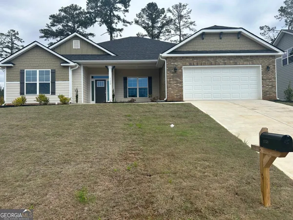 front view of a house with a yard