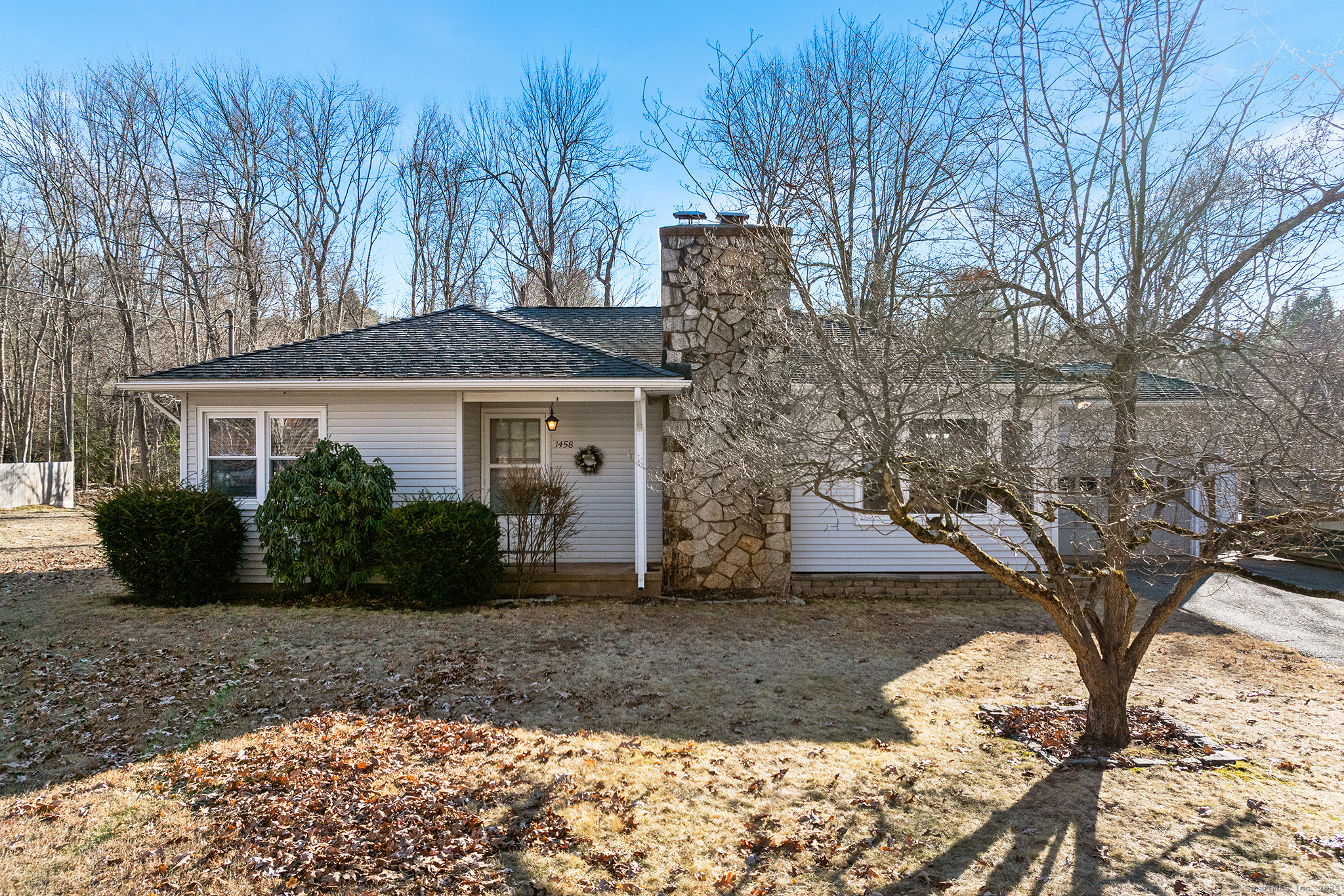 1458 Manchester Road Glastonbury, CT 06033 - Photo 1 of 1 a front view of a house with a yard and potted plants