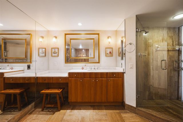 a bathroom with a tub sink and shower