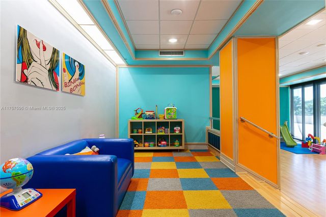 a view of a patio with table and chairs with wooden floor and floor to ceiling window