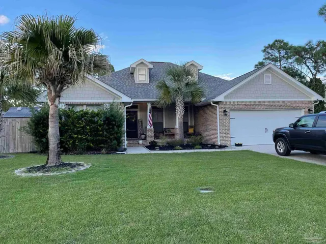 a view of a house with a yard porch and sitting area