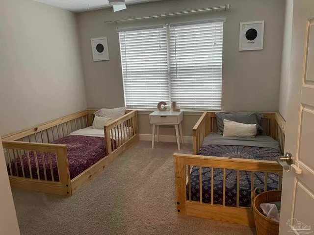 a bedroom with furniture and a window