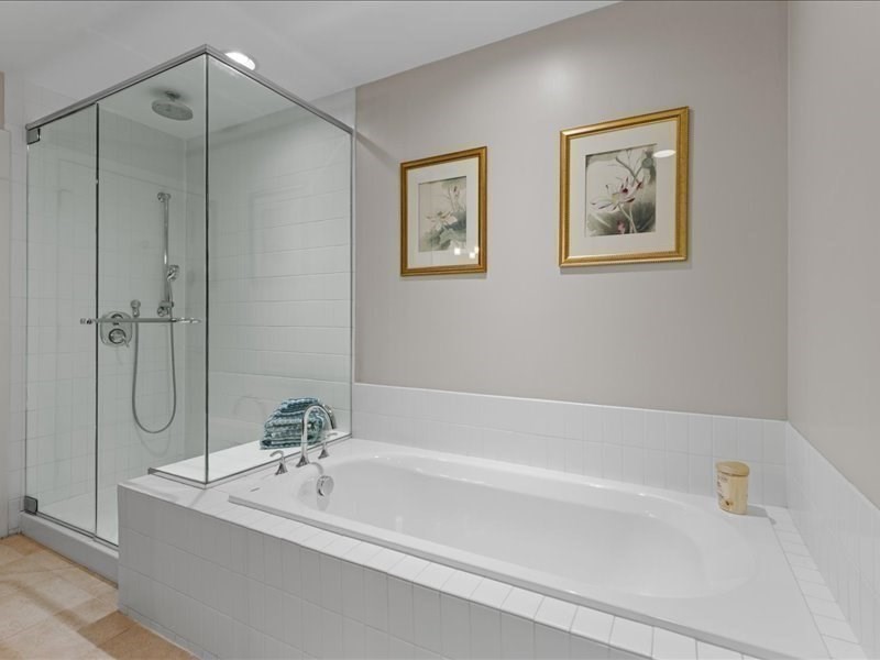 1245 Adams Street, Unit B210 Boston, MA 02124 - Photo 20 of 39 a bathroom with a bathtub and a shower