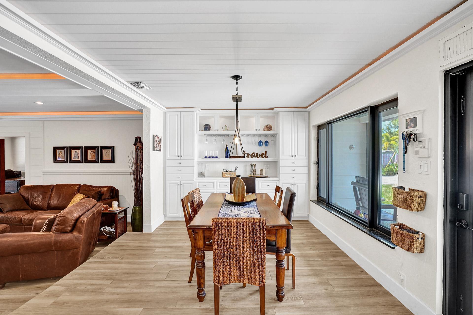 5612 Harding Street Hollywood, FL 33021 - Photo 11 of 59 a view of a dining room with furniture window and wooden floor