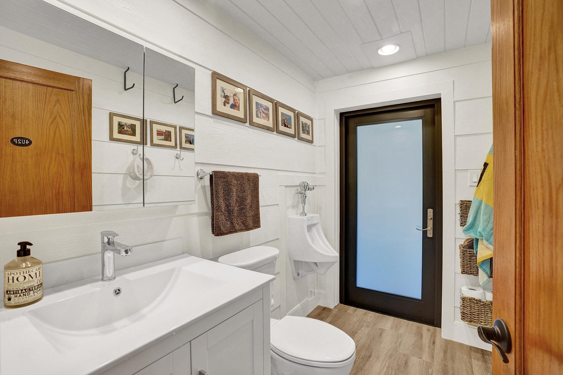 5612 Harding Street Hollywood, FL 33021 - Photo 12 of 59 a bathroom with a sink a toilet and shower