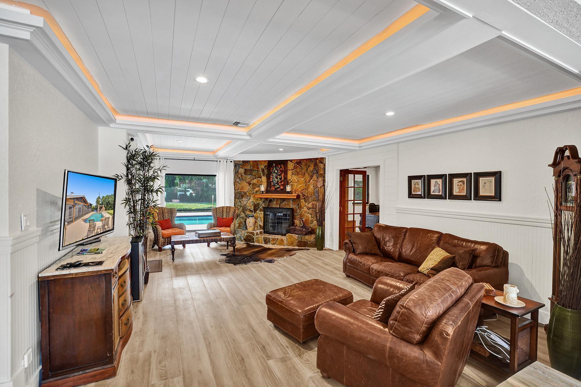 5612 Harding Street Hollywood, FL 33021 - Photo 17 of 59 a living room with furniture and a flat screen tv