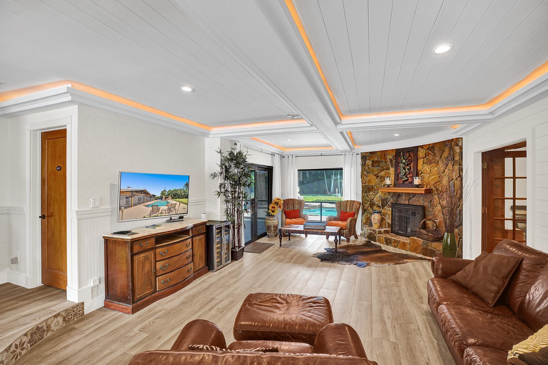 5612 Harding Street Hollywood, FL 33021 - Photo 18 of 59 a living room with furniture fireplace and a large window