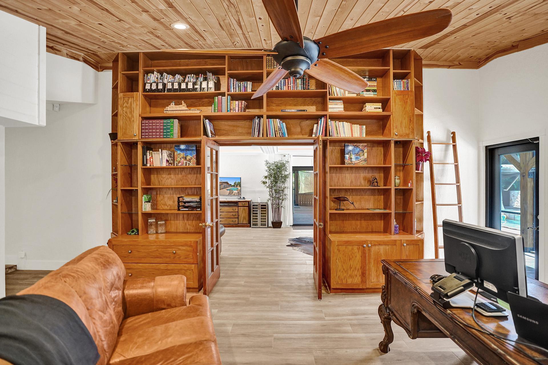 5612 Harding Street Hollywood, FL 33021 - Photo 23 of 59 a living room with furniture cabinets and window
